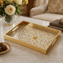 Orange Floral Scrollwork Gold Decorative Tray with Mughal Petals and Gold Frame | Minti Home on a coffee table, featuring UV-printed artwork on tempered glass with an electroplated frame and matching handles.