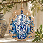 Hamsa Hand blue watercolor wood hanging wall decor with evil eye, crescent moon, leafy vines, and printed wood-grain border.
