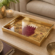 Qatar Vintage Glass Serving Tray – Desert Castle Crest on a coffee table, featuring UV-printed artwork on tempered glass with an electroplated frame and matching handles.