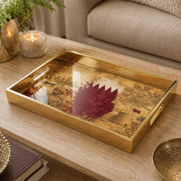 Qatar Vintage Glass Serving Tray – Desert Castle Crest on a coffee table, featuring UV-printed artwork on tempered glass with an electroplated frame and matching handles.