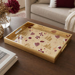 Qatar Heritage Glass Serving Tray – Patterned Flag Icons on a coffee table, featuring UV-printed artwork on tempered glass with an electroplated frame and matching handles.