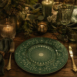 Decorative charger plate on a linen table.