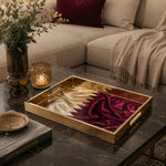 Qatar Flag Silk Glass Serving Tray – Maroon Filigree styled on a console table with a ceramic mug and books beside a brass lamp.