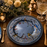 Songbirds and berries wreath of bluebirds, robins, and woodpeckers on a navy decorative charger plate with gilded scroll rim for winter table decor.

Plate type: electroplated (blue)