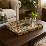 Colorful Fall Leaves Plastic Serving Tray – Full Print Border styled on a coffee table with books, a candle, and decorative accessories.