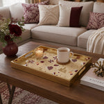 Qatar Heritage Glass Serving Tray – Patterned Flag Icons styled on a console table with a ceramic mug and books beside a brass lamp.