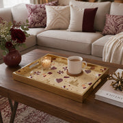 Qatar Heritage Glass Serving Tray – Patterned Flag Icons styled on a console table with a ceramic mug and books beside a brass lamp.