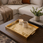 Middle East Skyline Glass Serving Tray – Mosque Towers styled on a console table with a ceramic mug and books beside a brass lamp.