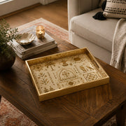 Middle East Tribal Geometric Glass Serving Tray – Camels styled on a console table with a ceramic mug and books beside a brass lamp.