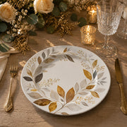 White ceramic decorative charger plate with a watercolor autumn leaf wreath in gold, ochre, and grey tones for modern tables.