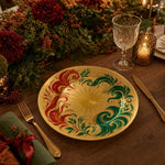 Decorative charger plate on a linen table.
