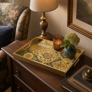 Moroccan Arch Decorative Tray with Gold Frame and Botanical Motifs | Minti Home styled on a console table with a ceramic mug and books beside a brass lamp.