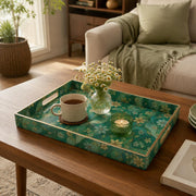 Persian Emerald Floral Plastic Serving Tray – Gold Lattice styled on a coffee table with books, a candle, and decorative accessories.