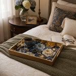 Navy Blue Peony Floral Glass Serving Tray with Gold Frame, 40x30cm styled on a console table with a ceramic mug and books beside a brass lamp.