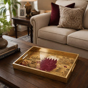 Qatar Vintage Glass Serving Tray – Desert Castle Crest styled on a console table with a ceramic mug and books beside a brass lamp.