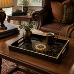 Persian Mandala Decorative Tray with Black and Gold Frame | Minti Home displayed on a dining table with a porcelain teapot and fresh flowers, vintage cabinet in background.