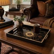 Persian Mandala Decorative Tray with Black and Gold Frame | Minti Home displayed on a dining table with a porcelain teapot and fresh flowers, vintage cabinet in background.