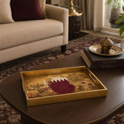 Qatar Vintage Glass Serving Tray – Desert Castle Crest displayed on a dining table with a porcelain teapot and fresh flowers, vintage cabinet in background.