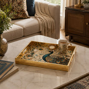 Diwali Peacock Decorative Tray with Gold Frame - Minti Home displayed on a dining table with a porcelain teapot and fresh flowers, vintage cabinet in background.