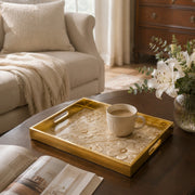 White Embroidered Floral Gold Decorative Tray with Couture Petals and Gold Frame | Minti Home displayed on a dining table with a porcelain teapot and fresh flowers, vintage cabinet in background.