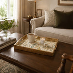 Persian Floral Decorative Tray with Gold Frame and Paisley Motifs | Minti Home displayed on a dining table with a porcelain teapot and fresh flowers, vintage cabinet in background.