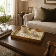 Persian Floral Decorative Tray with Gold Frame and Paisley Motifs | Minti Home displayed on a dining table with a porcelain teapot and fresh flowers, vintage cabinet in background.