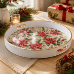 White tray with gold trim featuring red poinsettia holly and pine cone Christmas botanical pattern