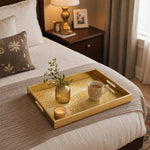 Mandala Glass Serving Tray – Cream Gold Lace Pattern displayed on a dining table with a porcelain teapot and fresh flowers, vintage cabinet in background.