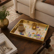 Ramadan Mosque Lantern Serving Tray with Gold Frame | Minti Home displayed on a dining table with a porcelain teapot and fresh flowers, vintage cabinet in background.