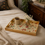 Christmas Poinsettia Holly Glass Serving Tray with Gold Frame, 40x30cm displayed on a dining table with a porcelain teapot and fresh flowers, vintage cabinet in background.