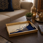 Islamic Glass Serving Tray – Blue Mandala & Arabic Calligraphy displayed on a dining table with a porcelain teapot and fresh flowers, vintage cabinet in background.