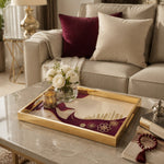 Qatar Flag Wind Glass Serving Tray – Falcon Skyline displayed on a dining table with a porcelain teapot and fresh flowers, vintage cabinet in background.