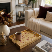 Qatar Heritage Glass Serving Tray – Patterned Flag Icons displayed on a dining table with a porcelain teapot and fresh flowers, vintage cabinet in background.
