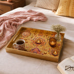 Diwali Lotus Mandala Decorative Tray with Diyas - Minti Home displayed on a dining table with a porcelain teapot and fresh flowers, vintage cabinet in background.
